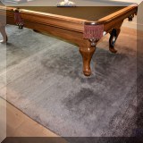 D31. Gray rug with ombre stripes. Meaures approx. 9' x 13' 